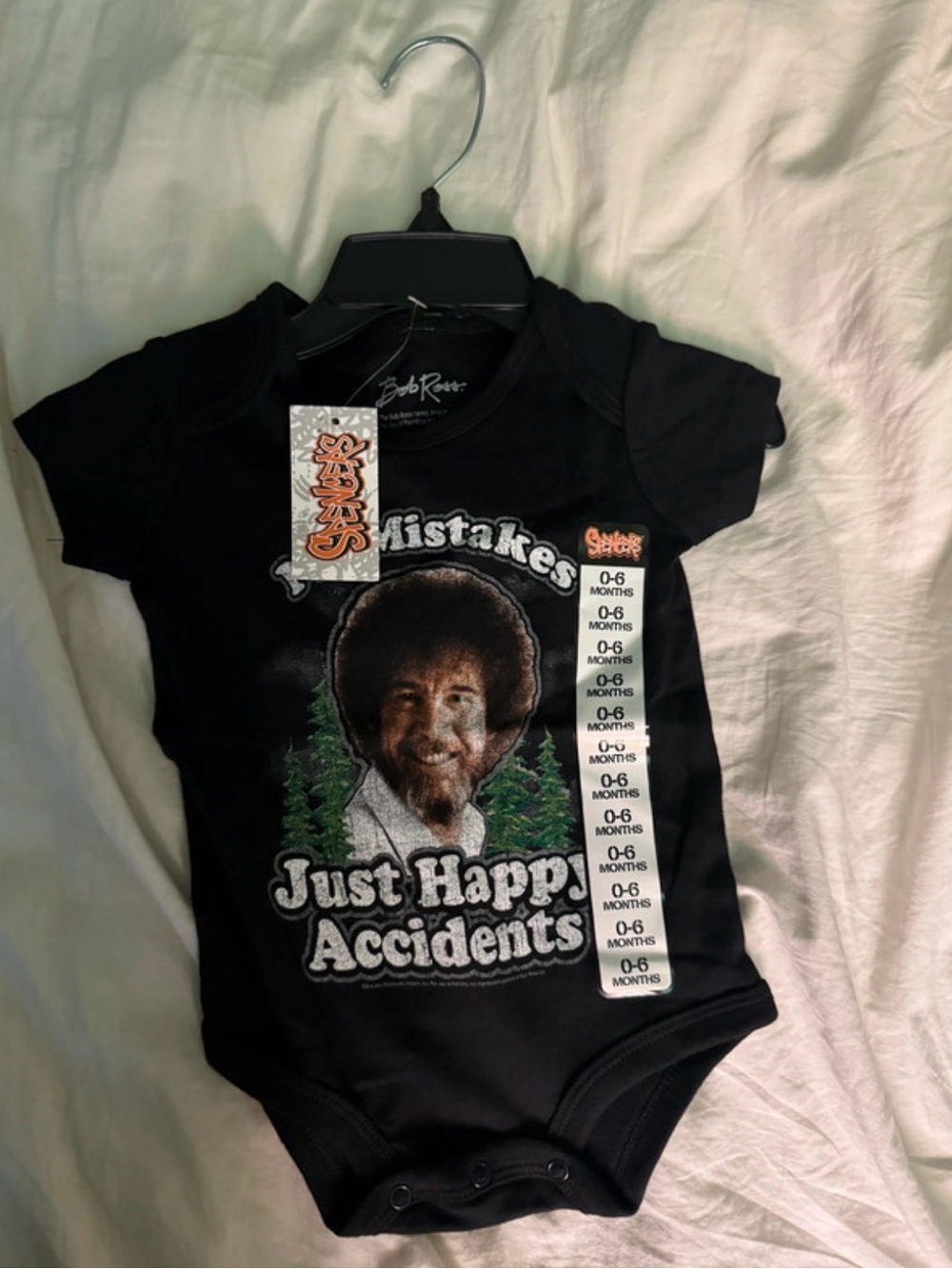Spencer's Black "Just Happy Accidents" Bob Ross Baby Bodysuit